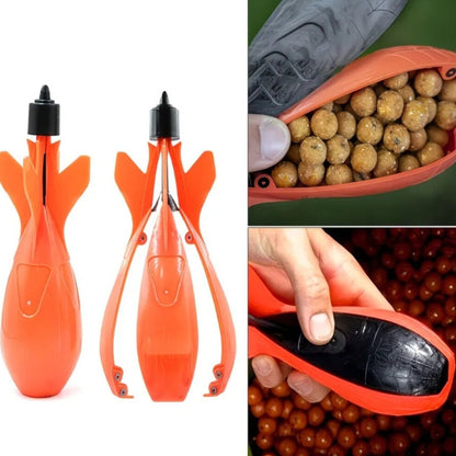Orange fishing lure with black top, close-up of lure, and hand holding it.